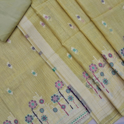Pastel yellow silk cotton unstitched salwar material,thread buttas on front,thread weaving on yoke and daman,(Silky, Lining Needed)matching silky bottom, floral buttas on silk cotton dupatta with thread weaving pallu and borders(TAPPING NEEDED). AP262208