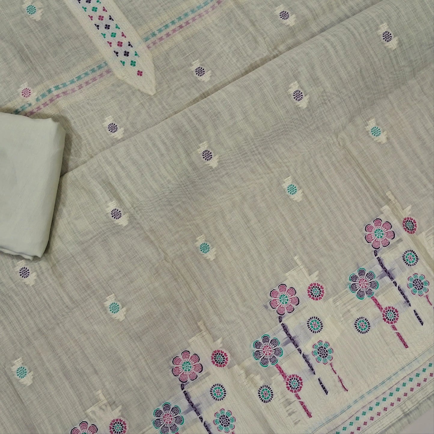 Rich beige silk cotton unstitched salwar material,thread buttas on front,thread weaving on yoke and daman,(Silky, Lining Needed)matching silky bottom, floral buttas on silk cotton dupatta with thread weaving pallu and borders(TAPPING NEEDED). AP262207