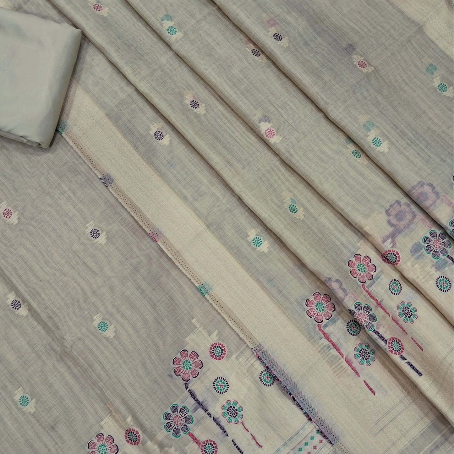 Rich beige silk cotton unstitched salwar material,thread buttas on front,thread weaving on yoke and daman,(Silky, Lining Needed)matching silky bottom, floral buttas on silk cotton dupatta with thread weaving pallu and borders(TAPPING NEEDED). AP262207