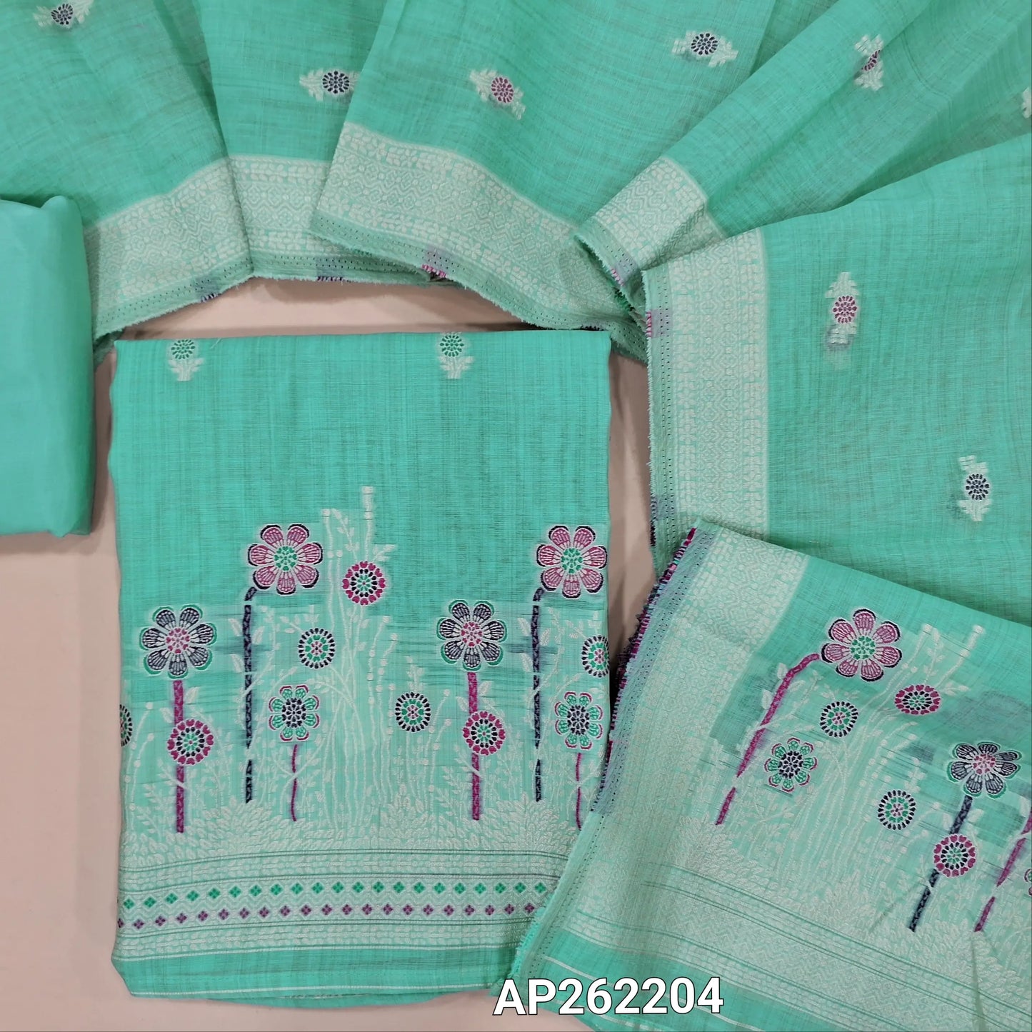 Pastel blue silk cotton unstitched salwar material,thread buttas on front,thread weaving on yoke and daman,(Silky, Lining Needed)matching silky bottom, floral buttas on silk cotton dupatta with thread weaving pallu and borders(TAPPING NEEDED). AP262204