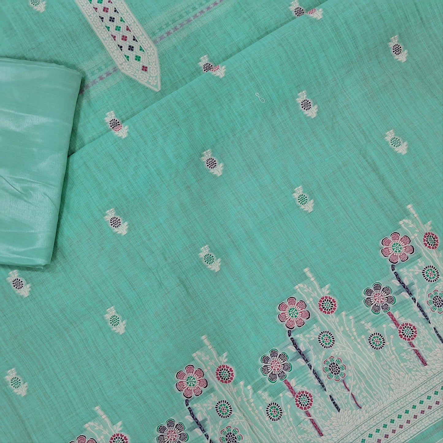 Pastel blue silk cotton unstitched salwar material,thread buttas on front,thread weaving on yoke and daman,(Silky, Lining Needed)matching silky bottom, floral buttas on silk cotton dupatta with thread weaving pallu and borders(TAPPING NEEDED). AP262204