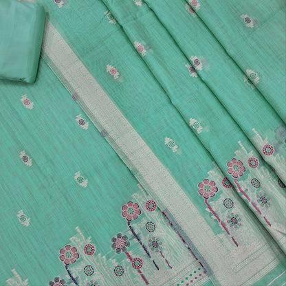 Pastel blue silk cotton unstitched salwar material,thread buttas on front,thread weaving on yoke and daman,(Silky, Lining Needed)matching silky bottom, floral buttas on silk cotton dupatta with thread weaving pallu and borders(TAPPING NEEDED). AP262204