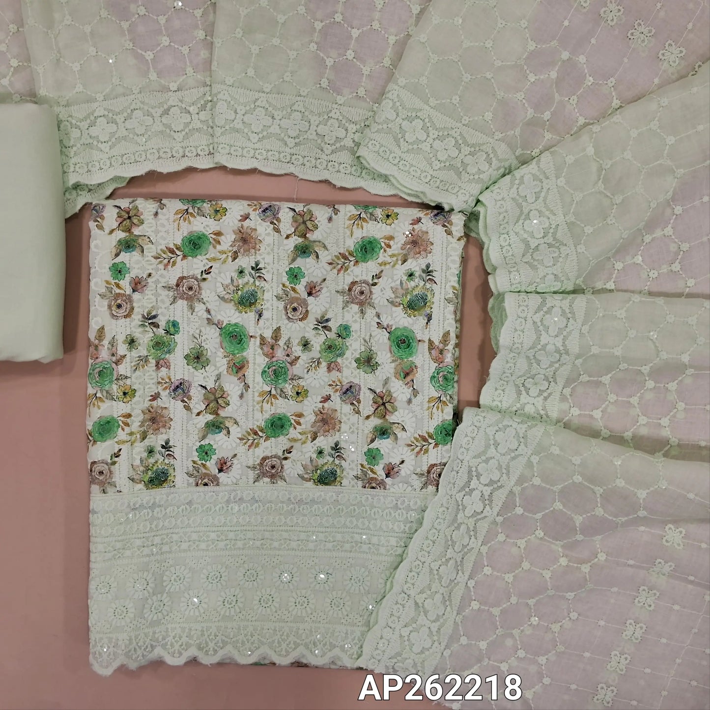 Pastel green floral printed glazed cotton unstitched salwar material (lining needed) self embroidery andsequins work on front,matching cotton bottom, embroidery and sequins work on mul cotton dupatta with scallop borders.(TAPING NEEDED) AP262218