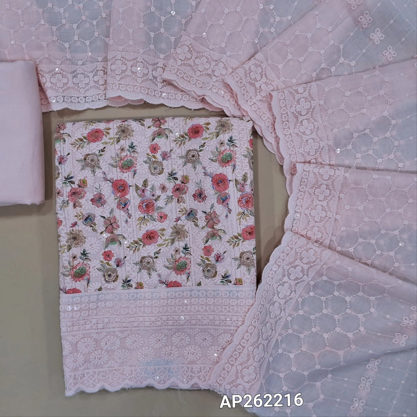 Pastel pink floral printed glazed cotton unstitched salwar material (lining needed) self embroidery and sequins work on front,matching cotton bottom, embroidery and sequins work on mul cotton dupatta with scallop borders.(TAPING NEEDED) AP262216