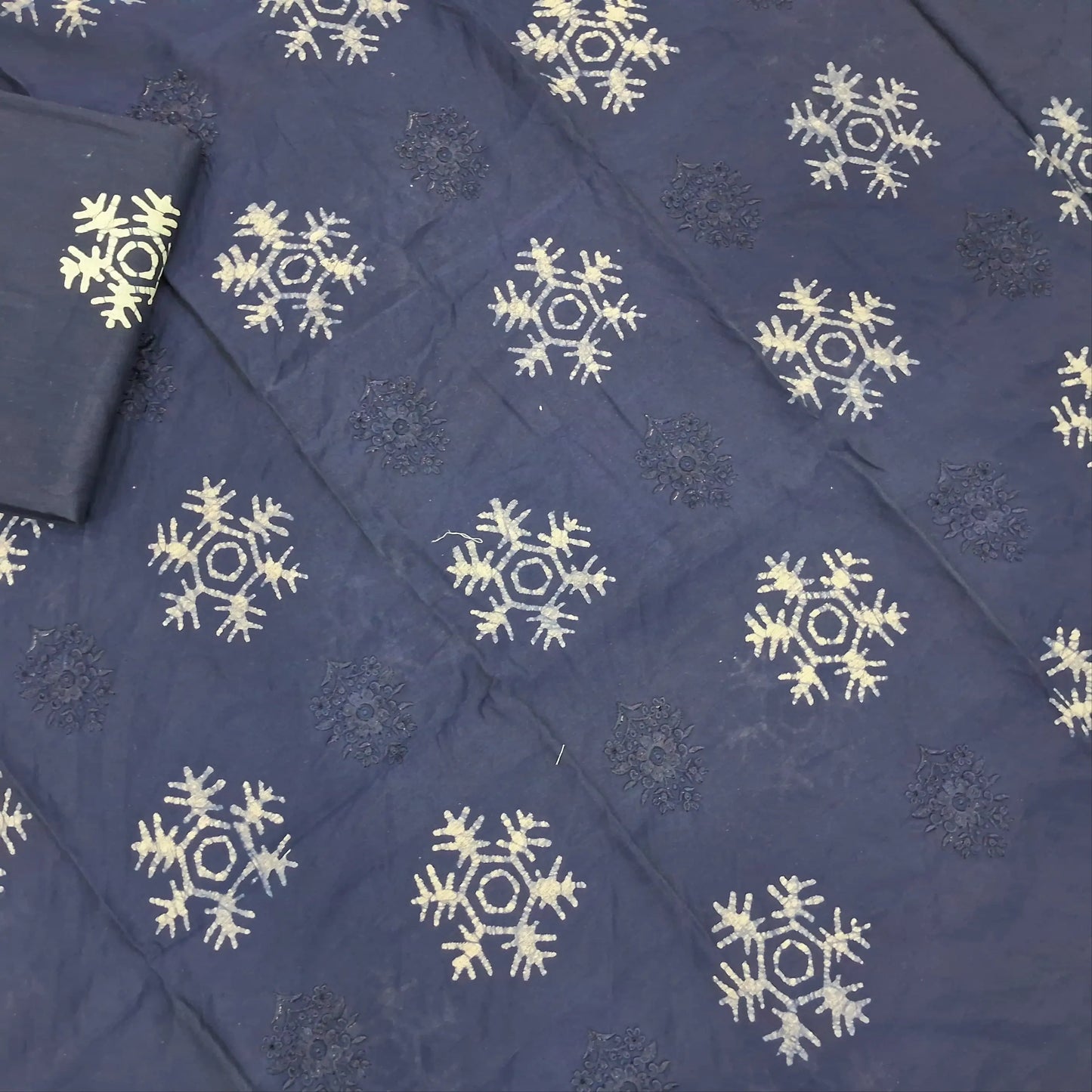 Dark blue premium silk cotton unstitched salwar material(lining needed)self embroidery work on front, batik design all over, wax batik cotton bottom, self embroidery and batik design on silk cotton dupatta with tissue borders.AP262210