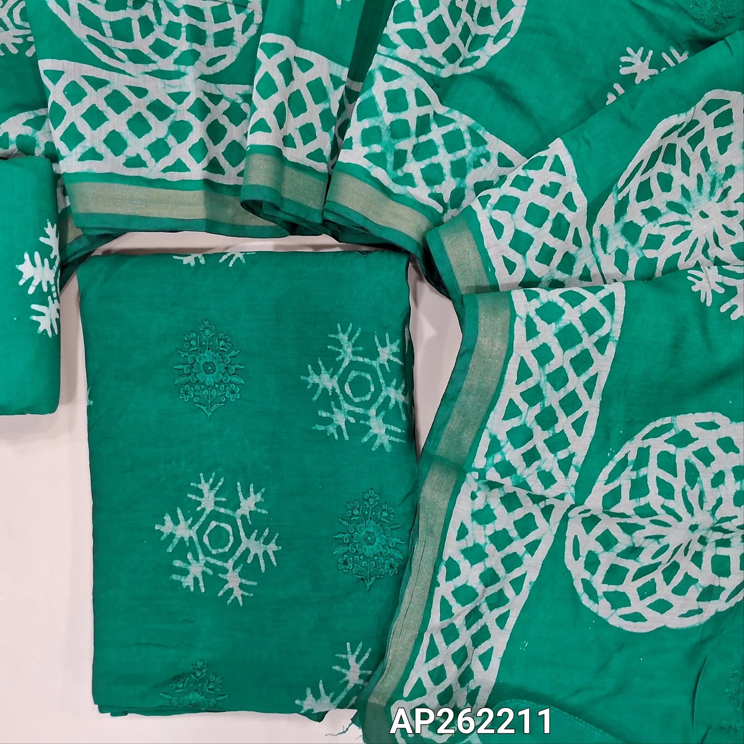 Peacock green premium silk cotton unstitched salwar material(lining needed)self embroidery work on front, batik design all over, wax batik cotton bottom, self embroidery and batik design on silk cotton dupatta with tissue borders.AP262211