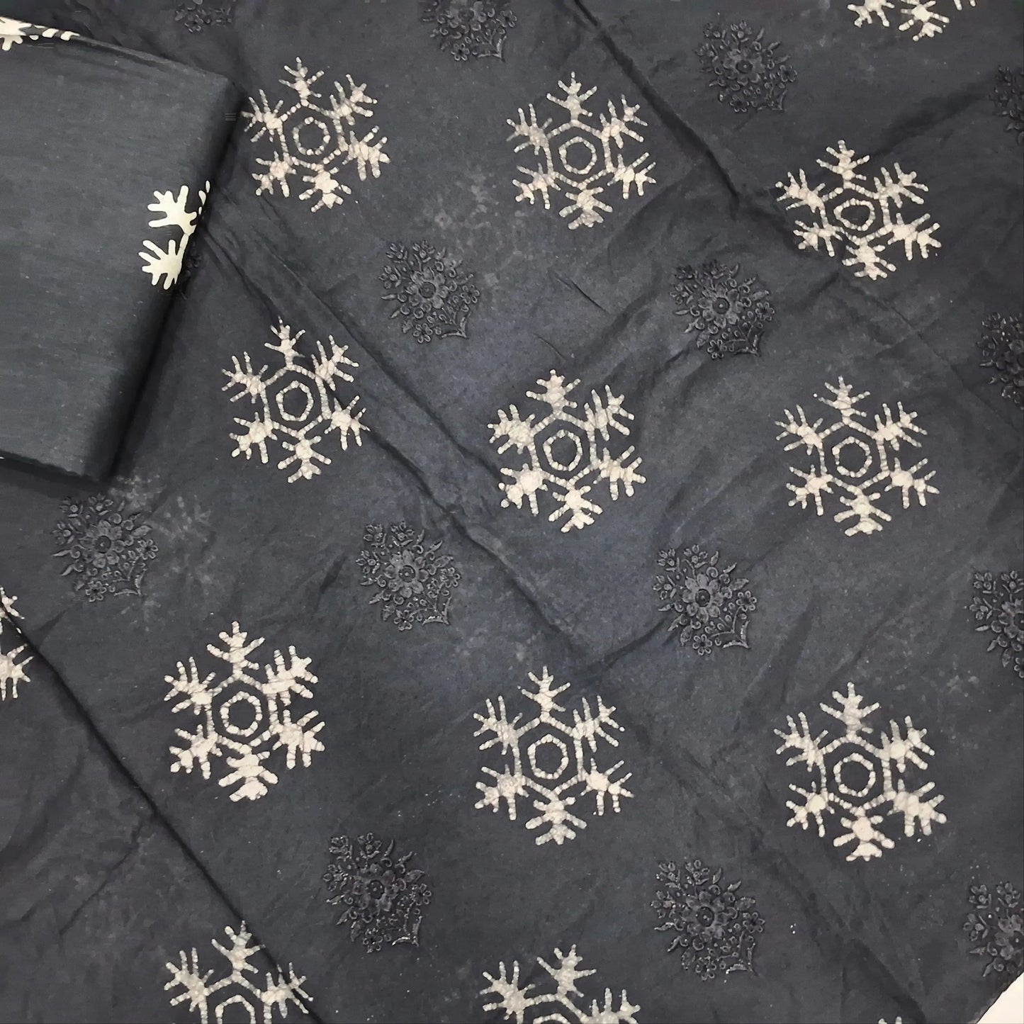 Black premium silk cotton unstitched salwar material(lining needed)self embroidery work on front, batik design all over, wax batik cotton bottom, self embroidery and batik design on silk cotton dupatta with tissue borders.AP262212