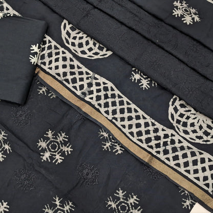 Black premium silk cotton unstitched salwar material(lining needed)self embroidery work on front, batik design all over, wax batik cotton bottom, self embroidery and batik design on silk cotton dupatta with tissue borders.AP262212