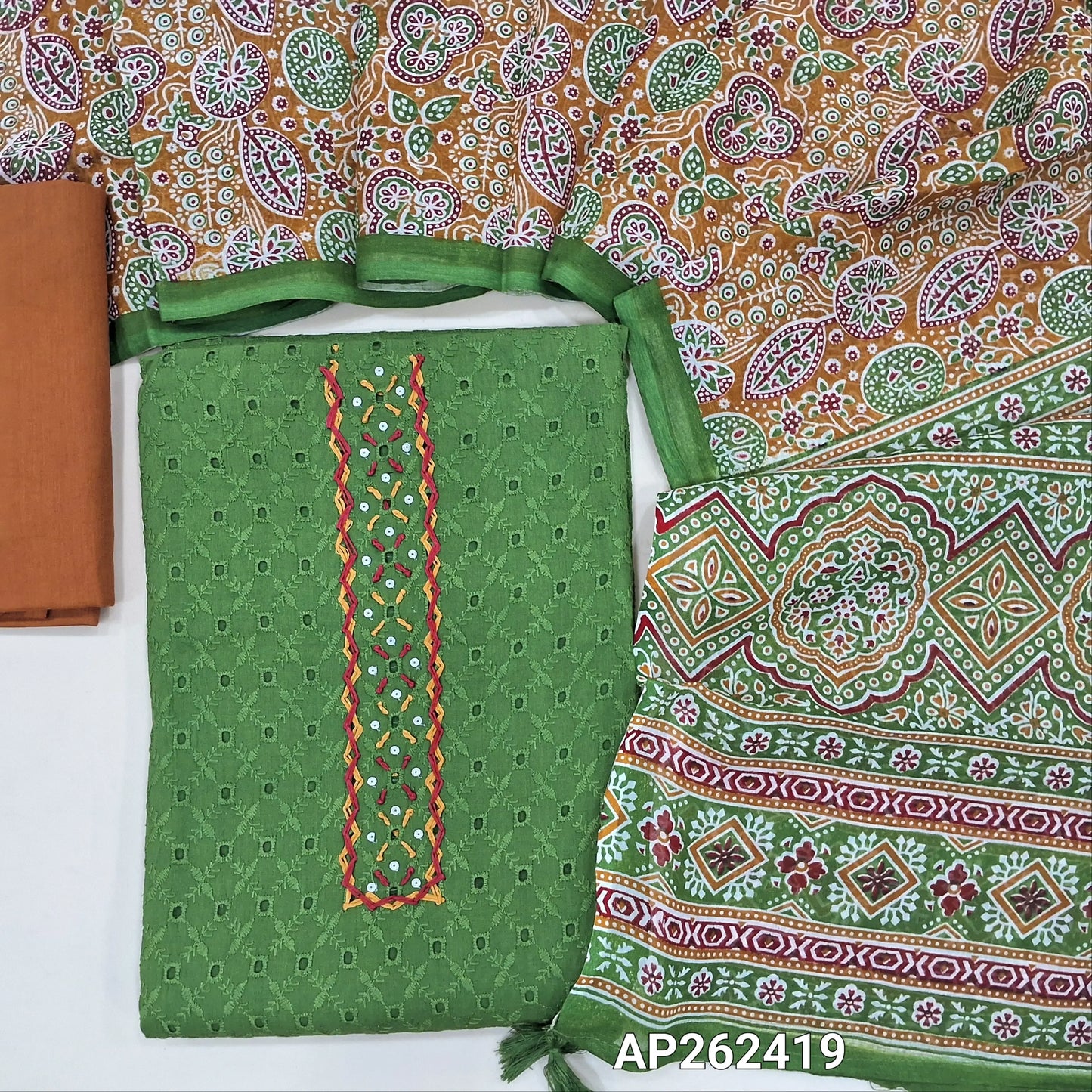 Dark leafy green schiffli embroidered pure cotton unstitched salwar material(lining needed)hand embroidery, cut work and sequins work on yoke, brick red drum dyed cotton bottom,printed premium soft mul cotton dupatta. AP262419