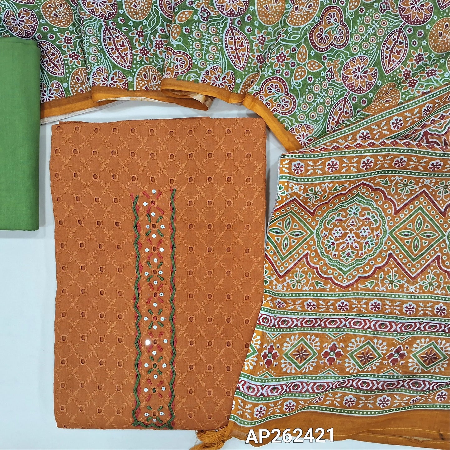 Light brown schiffli embroidered pure cotton unstitched salwar material(lining needed)hand embroidery, cut work and sequins work on yoke, green drum dyed cotton bottom,printed premium soft mul cotton dupatta. AP262421