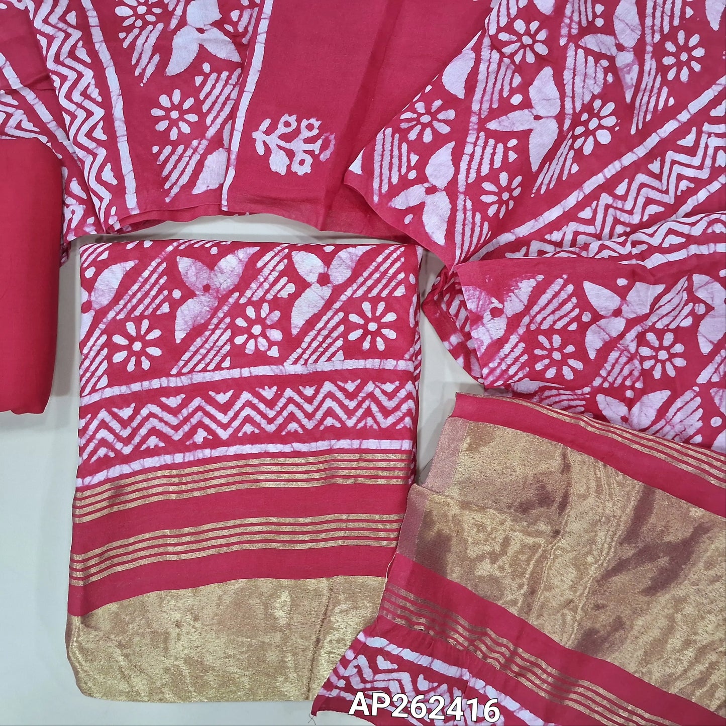 Bright pink original wax batik dyed fancy silk cotton unstitched salwar material(lining needed) tissue borders on daman, matching cotton bottom, batik dyed fancy silk cotton dupatta with tissue pallu. AP262416