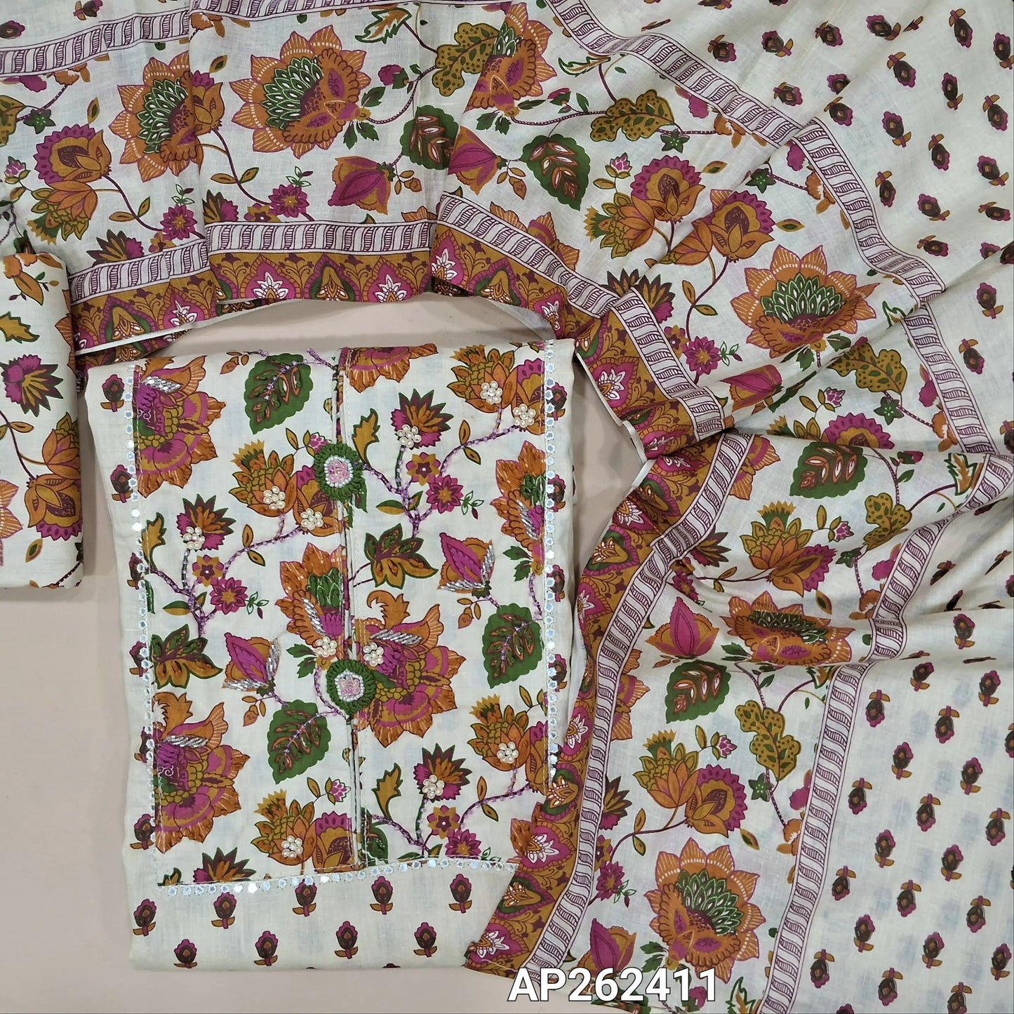 Light beige base floral printed pure cotton unstitched salwar material, thread embroidery ,cut bead, sugar bead and sequins work on yoke (lining optional) printed cotton bottom, printed full length soft mul cotton dupatta. AP262411