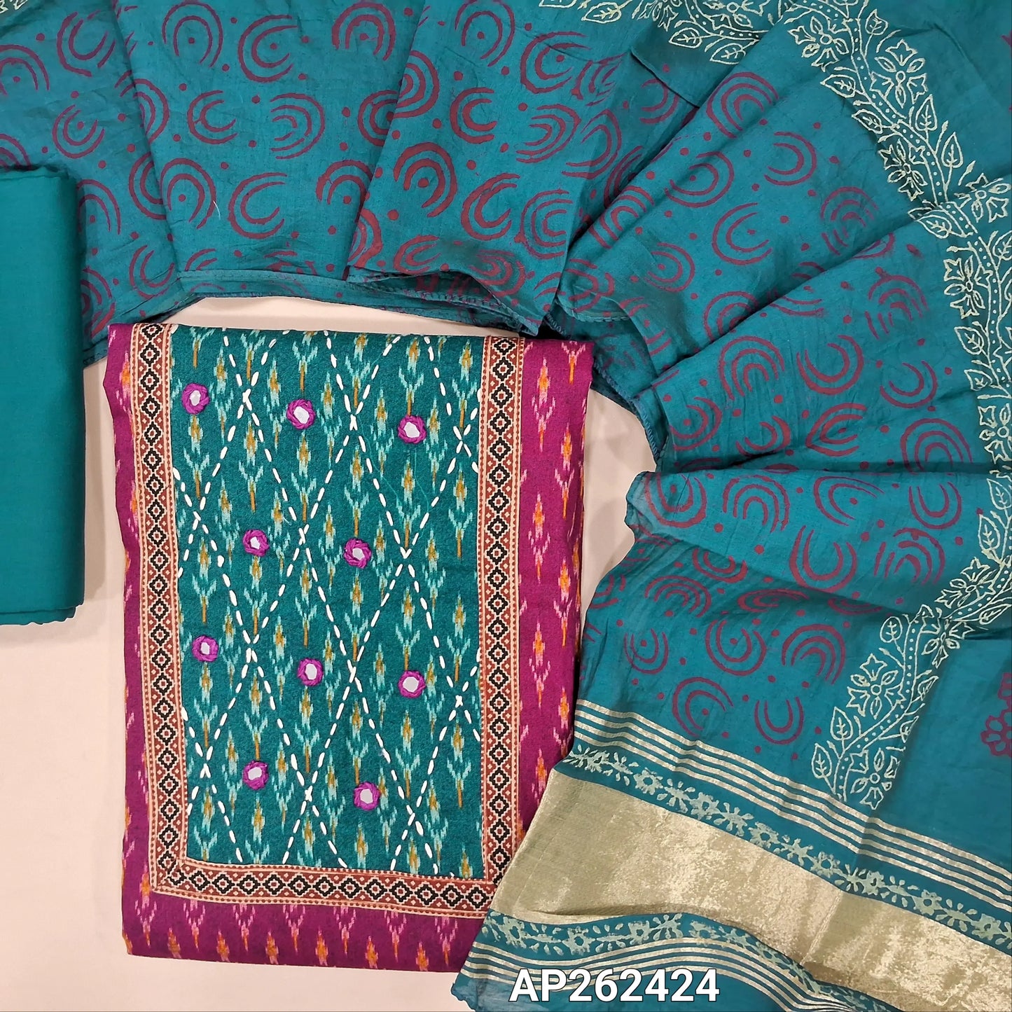 Ikat printed rani pink soft cotton unstitched salwar material (lining optional) real mirror, printed on yoke, teal blue spun cotton bottom, block printed fancy silk cotton dupatta with tissue border pallu. AP262424
