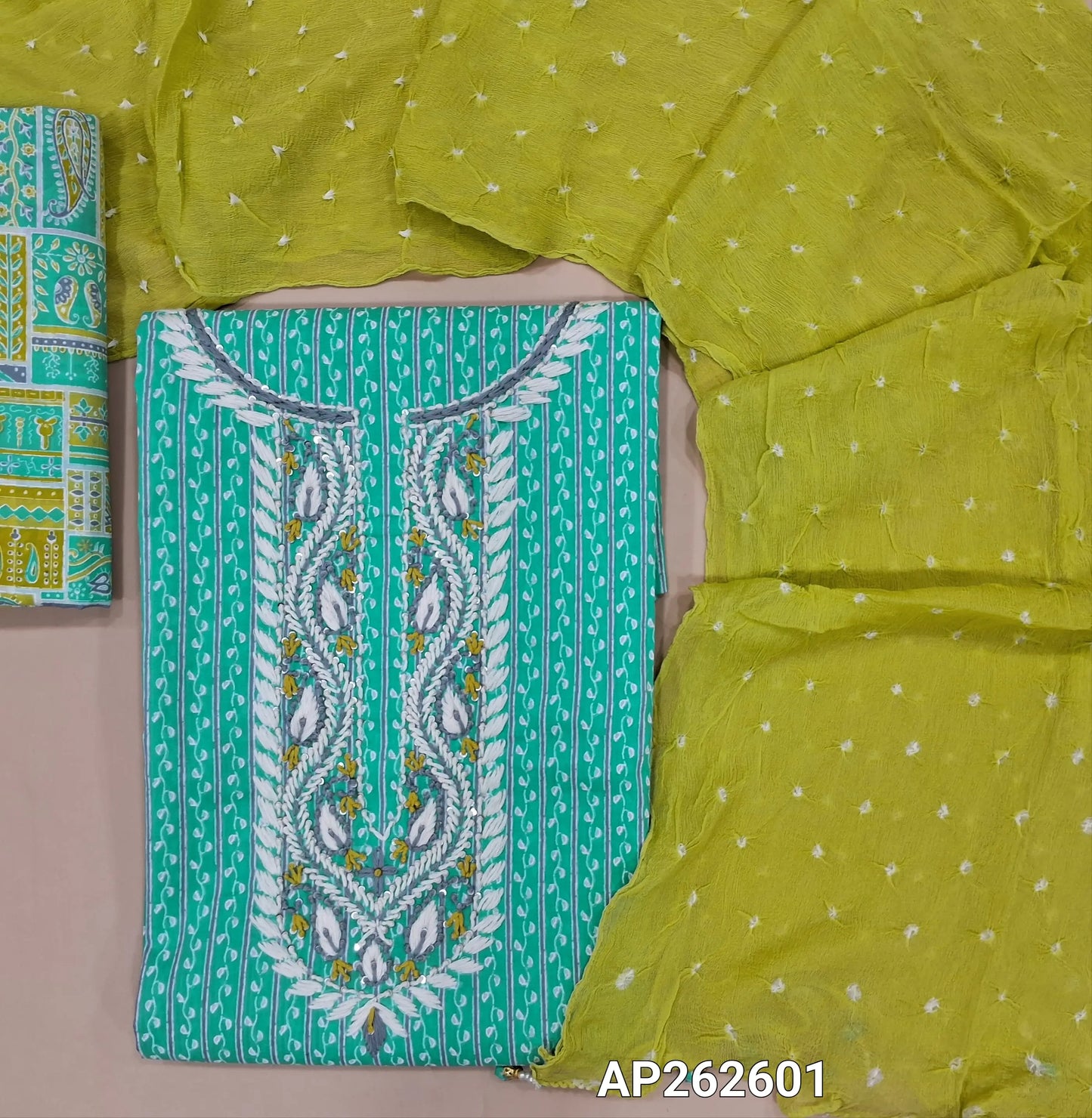 Pastel blue vertical printed pure cotton unstitched salwar material, hand embroidered work on yoke, (lining optional)multicolor cotton bottom ,sage green original bandhini dyed and pure chiffon short width dupatta. AP262601