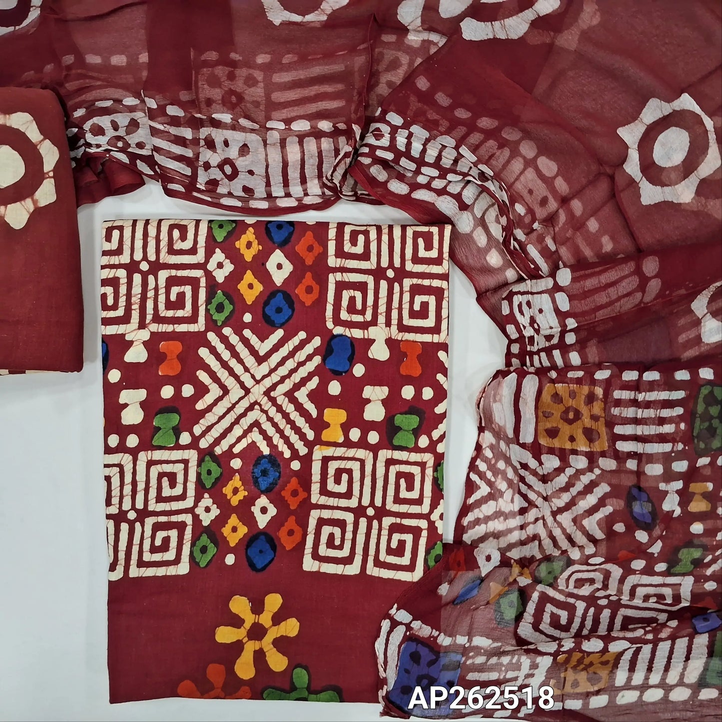 Reddish maroon multicoloured wax batik dyed pure cotton unstitched salwar material,(lining optional)batik dyed pure cotton bottom, batik design on pure chiffon dupatta (TAPPING NEEDED). AP262518