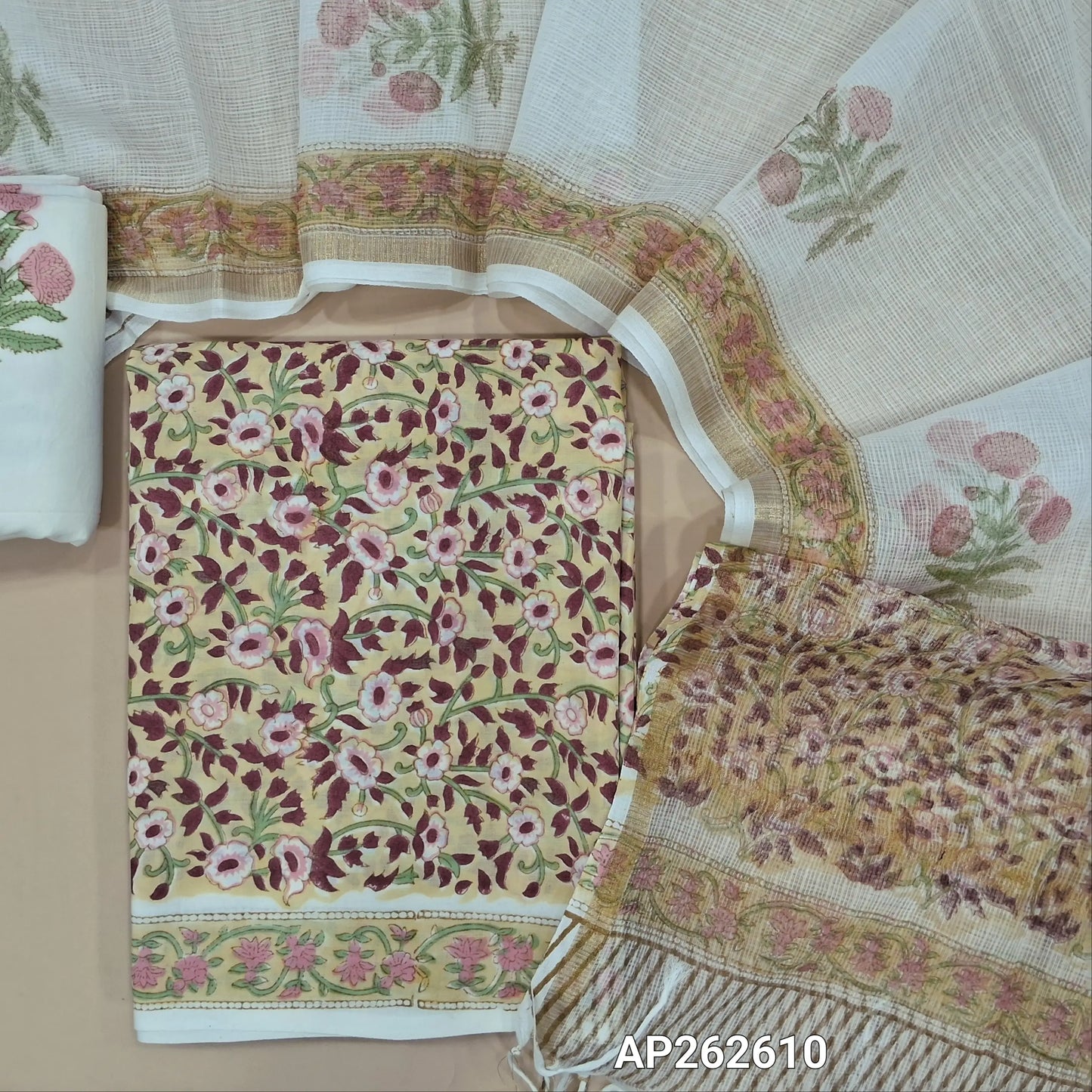 Pastel yellow hand block printed pure mul cotton unstitched salwar material, (lining needed) hand block printed cotton bottom,block printed kota cotton dupatta with tissue borders.(TAPINGS NEEDED, INCONSISTENT PRINTS ARE NOT DEFECTS) AP262610