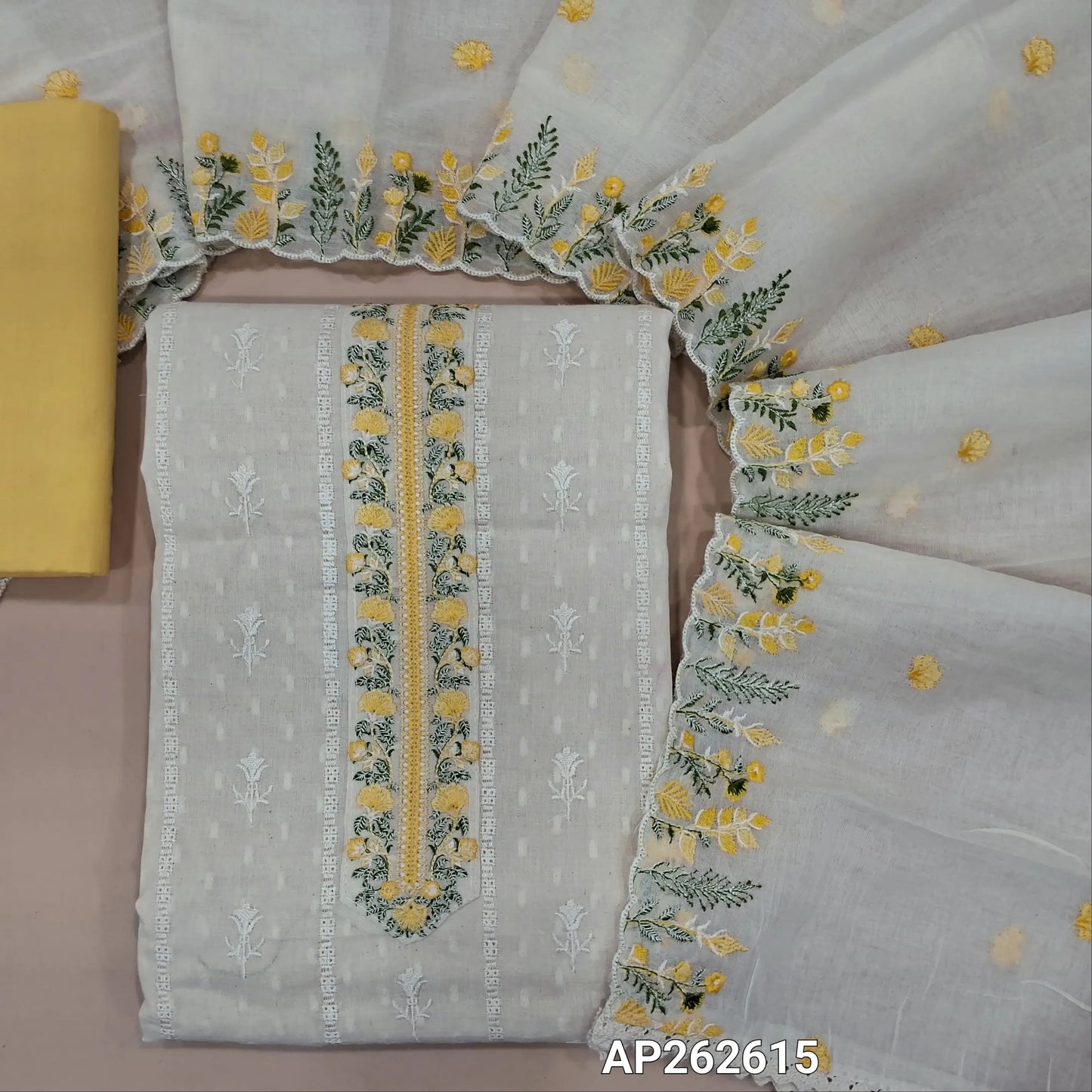 Off white base premium dobby cotton unstitched salwar material,embroidered yoke,self woven and self embroidery design on front  (lining needed)pastel yellow cotton bottom,embroidered mul cotton dupatta with scallop borders. AP262615