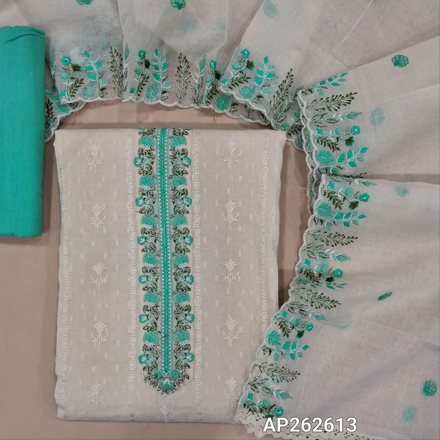 Off white base premium dobby cotton unstitched salwar material,embroidered yoke,self woven and self embroidery design on front  (lining needed)pastel blue cotton bottom,embroidered mul cotton dupatta with scallop borders. AP262613