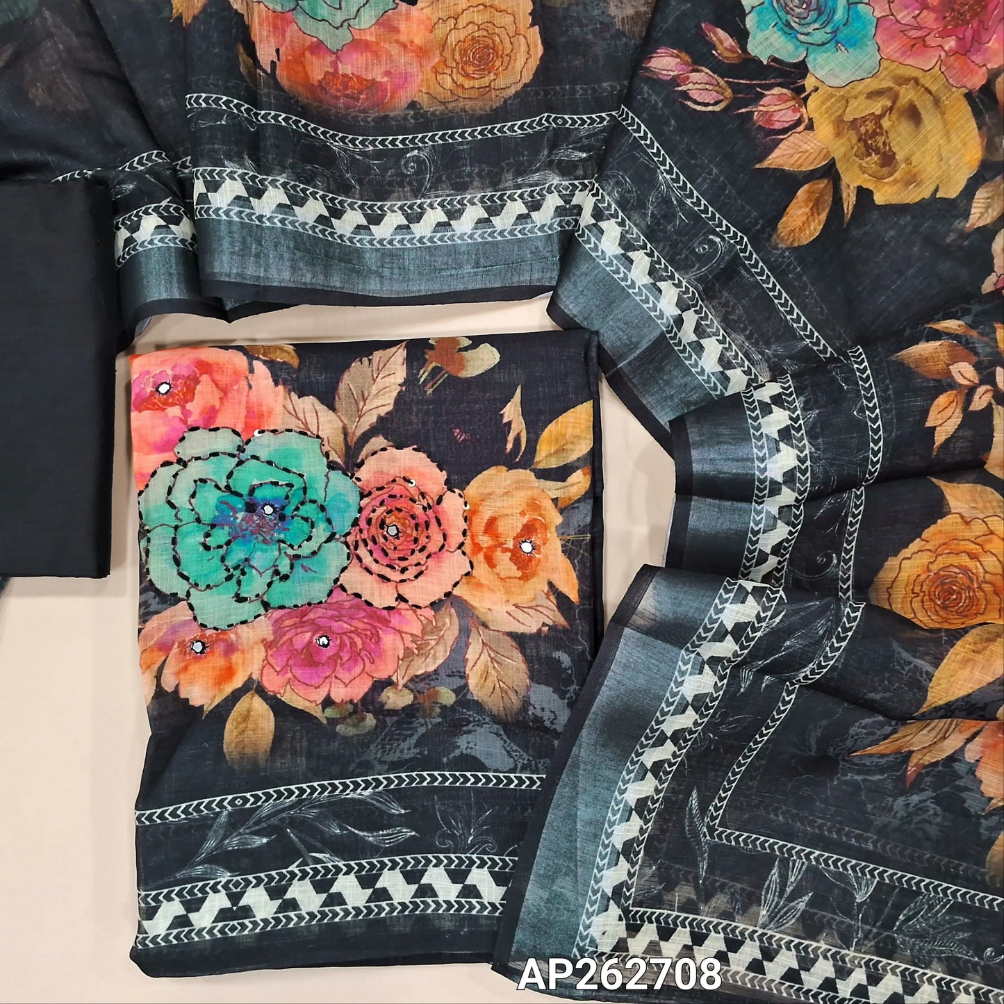 Black premium semi linen unstitched salwar material(lining needed) faux mirror ,thread embroidery and sequins work on yoke and daman,matching silk cotton bottom, digital printed semi linen full length dupatta with silver borders. AP262708