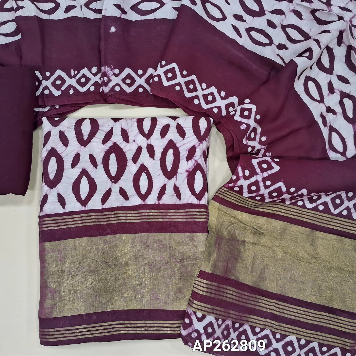 Deep wine purple original wax batik dyed soft modal silk cotton unstitched salwar material(lining needed)golden tissue on daman,santoom bottom,wax batik dyed soft modal silk cotton dupatta with gold tissue borders.AP262809