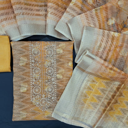 Golden beige zigzag printed premium kota unstitched salwar material, zari & sequins work on yoke, zari woven buttas on front(thin fabric, lining needed)matching silk cotton bottom, premium kota dupatta with zari buttas& gold tissue pallu. CODE AG240817