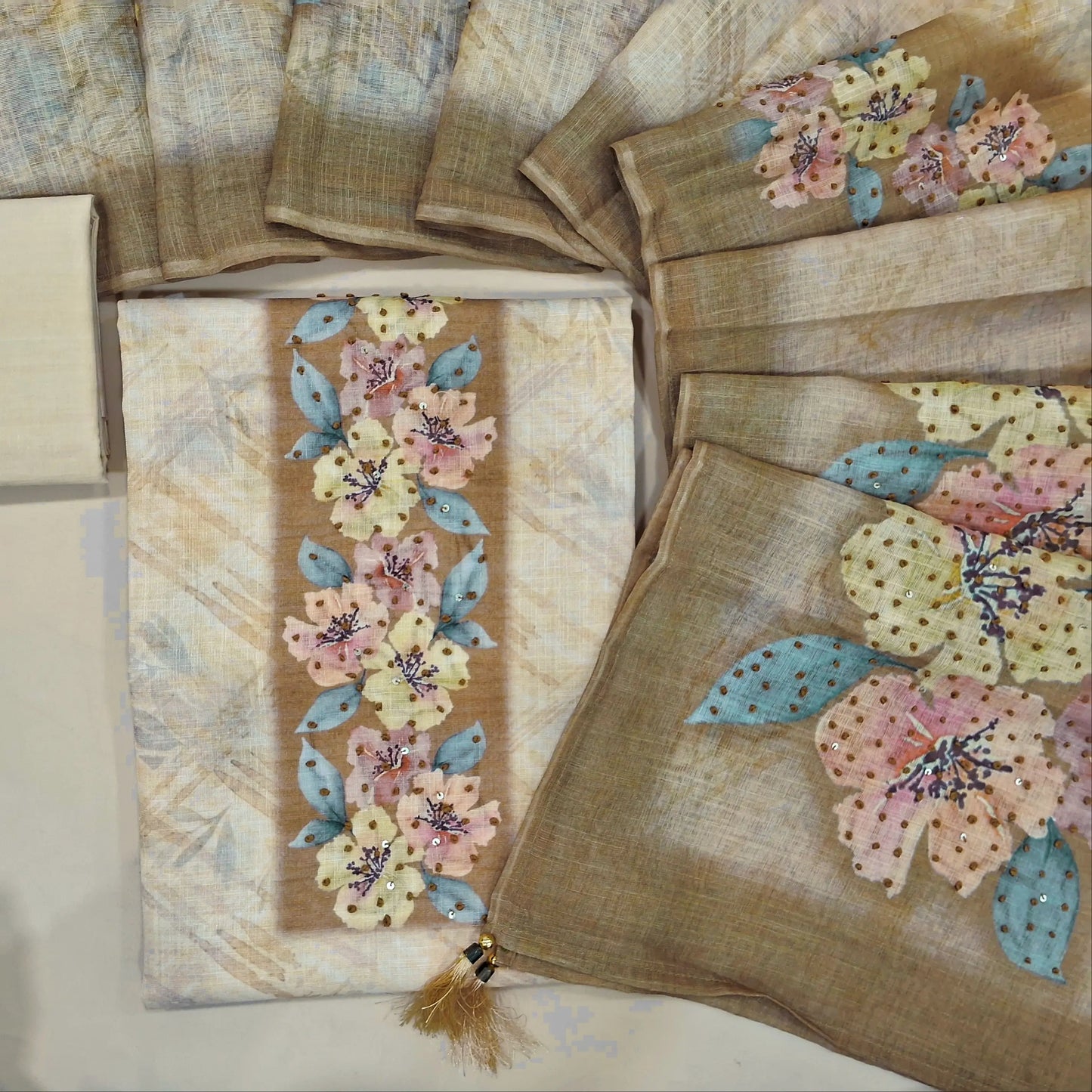 Rich beige designer pure linen unstitched salwar material, floral printed with thread work on yoke(thin fabric, lining needed)drum dyed cotton fabric provided for lining, NO BOTTOM, floral printed heavy thread worked linen dupatta. CODE JN242623