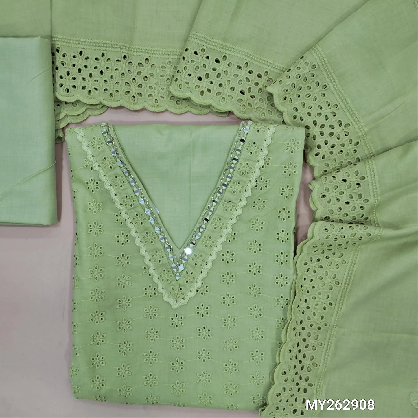 Pastel green schiffli embroidered soft glazed cotton unstitched salwar material(lining needed) lace detailing & real mirror work on yoke,embroidery allover, cotton bottom, schiffli embroidered & cut work, mul cotton dupatta with scallop borders. MY262908