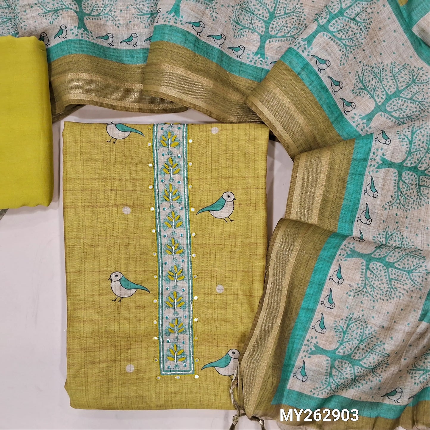 Designer yellow digital printed silk cotton unstitched salwar material (lining needed) thread embroidery & faux mirror work on yoke,bird prints all over, matching spun cotton bottom, digital printed silk cotton dupatta with gold tissue borders.MY262903