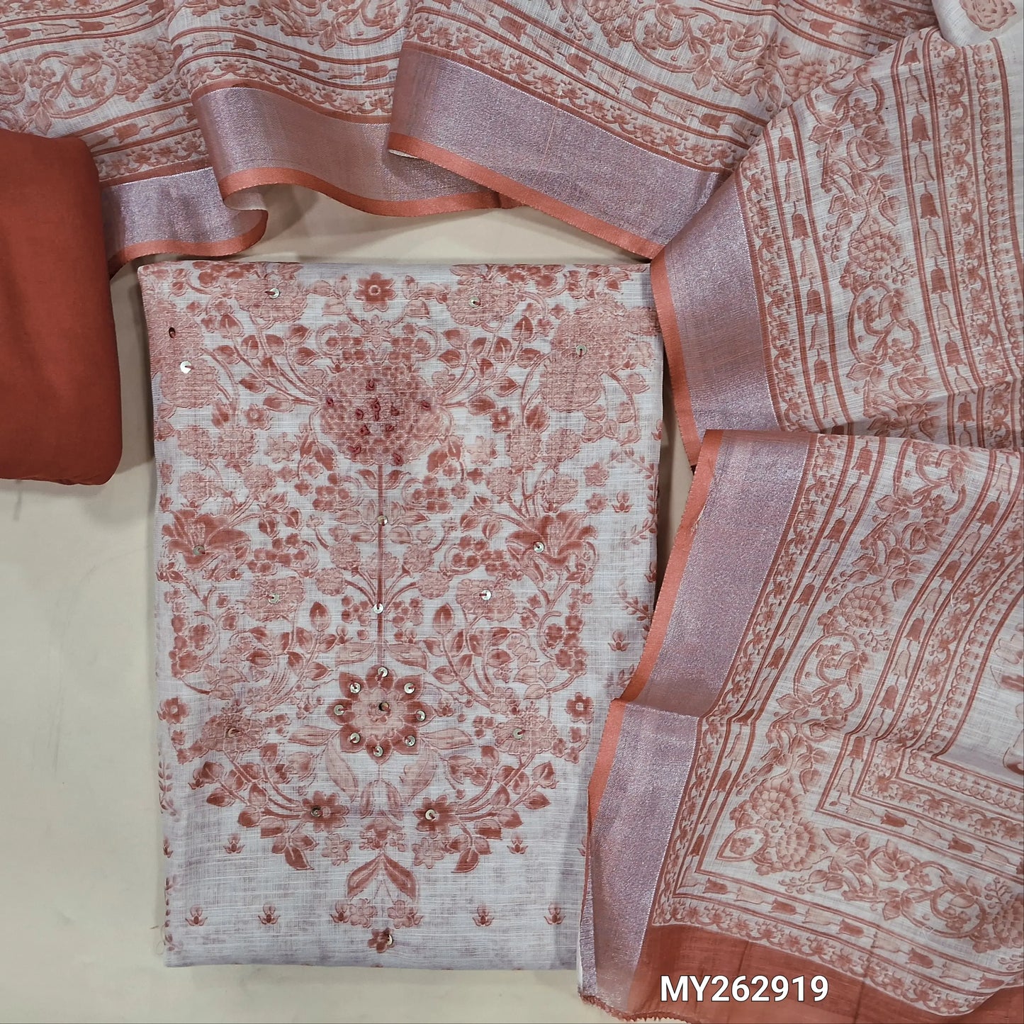Beige base premium semi linen salwar material , french knot, sequins work on yoke,digital printed and panel design,(textured, lining needed)brick red spun cotton bottom,digital printed semi linen dupatta with silver tissue borders. MY262919