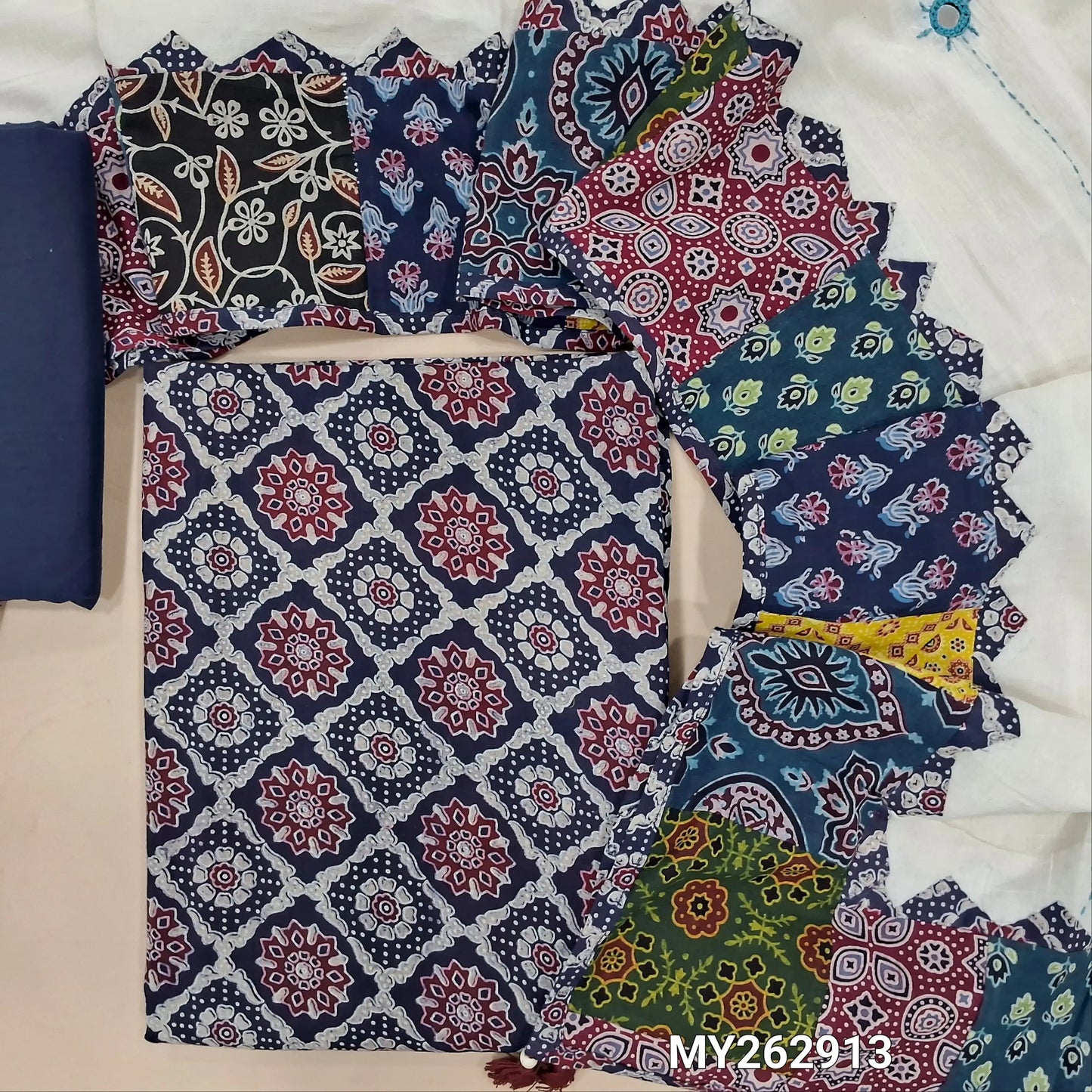 Navy blue ajrak hand block printed pure cotton unstitched salwar material(lining optional) cotton bottom, designer hand made with real mirror, kantha stitch & applique work dupatta with ajrak borders on tassles. MY262913
