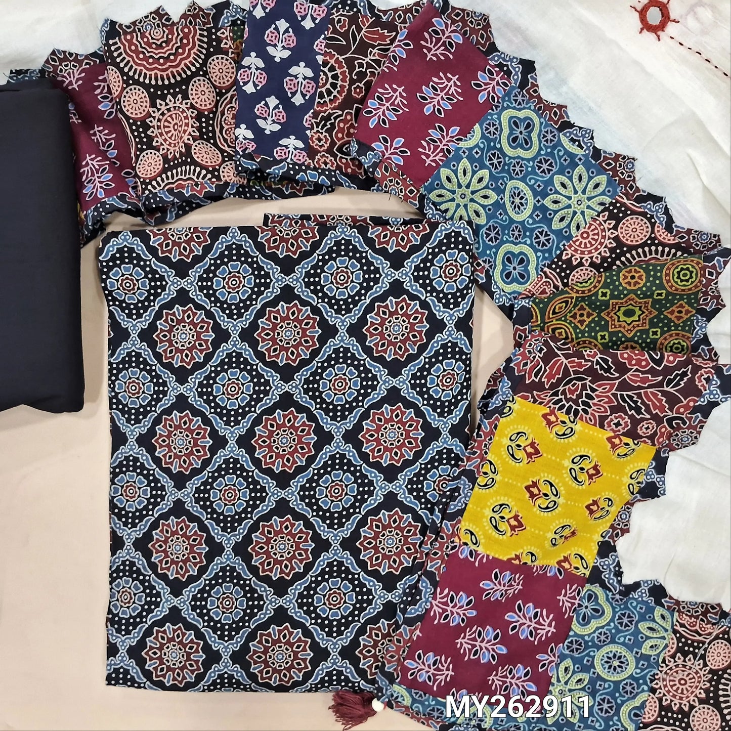 Dark blue ajrak hand block printed pure cotton unstitched salwar material(lining optional) cotton bottom, designer hand made with real mirror, kantha stitch & applique work dupatta with ajrak borders on tassles. MY262911
