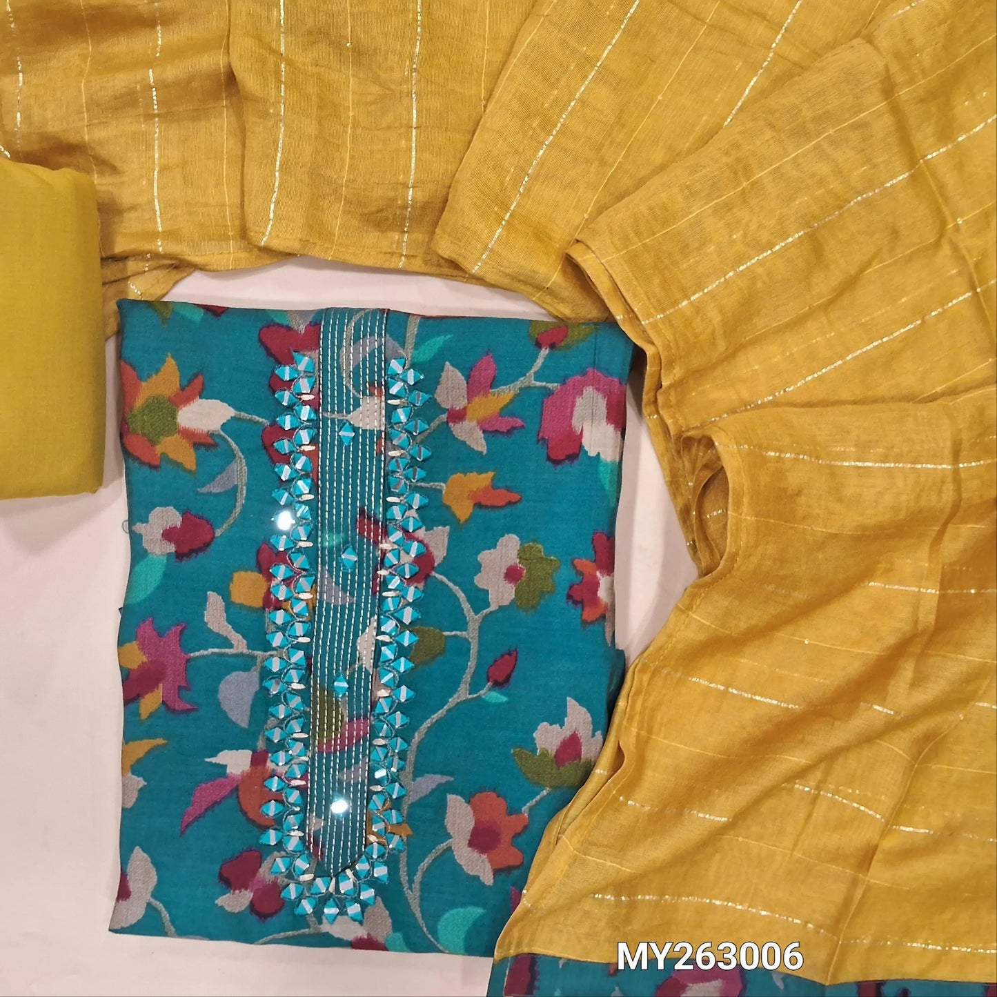 Dark teal blue  floral printed muslin silk unstitched salwar material,zari lines and real mirror work on yoke( soft,textured,lining optional)yellow cotton bottom, zari lines and sequins work on soft silk cotton short width dupatta. MY263006