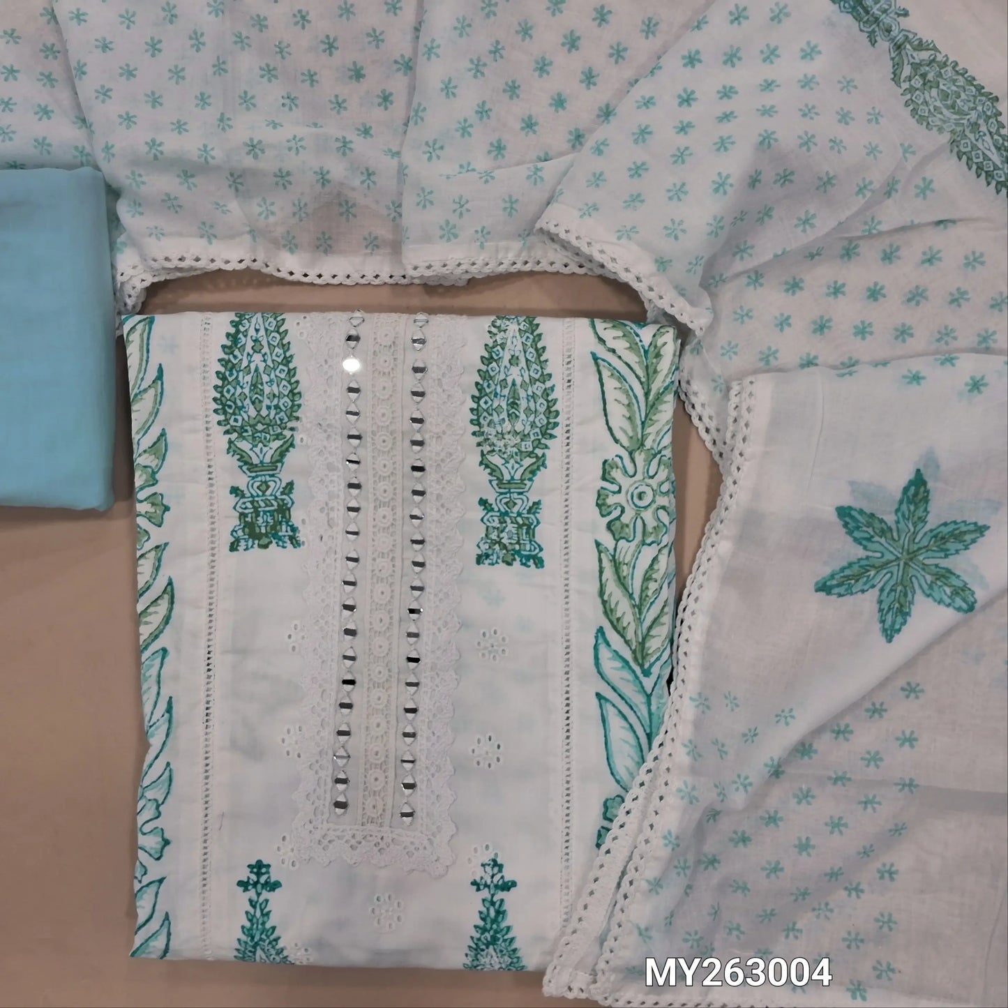 White hand block printed pure cotton unstitched salwar material, (lining needed) schiffli embroidery,real mirror & lace detailing on yoke,penal design, blue cotton bottom,block printed full length soft mul cotton dupatta. MY263004