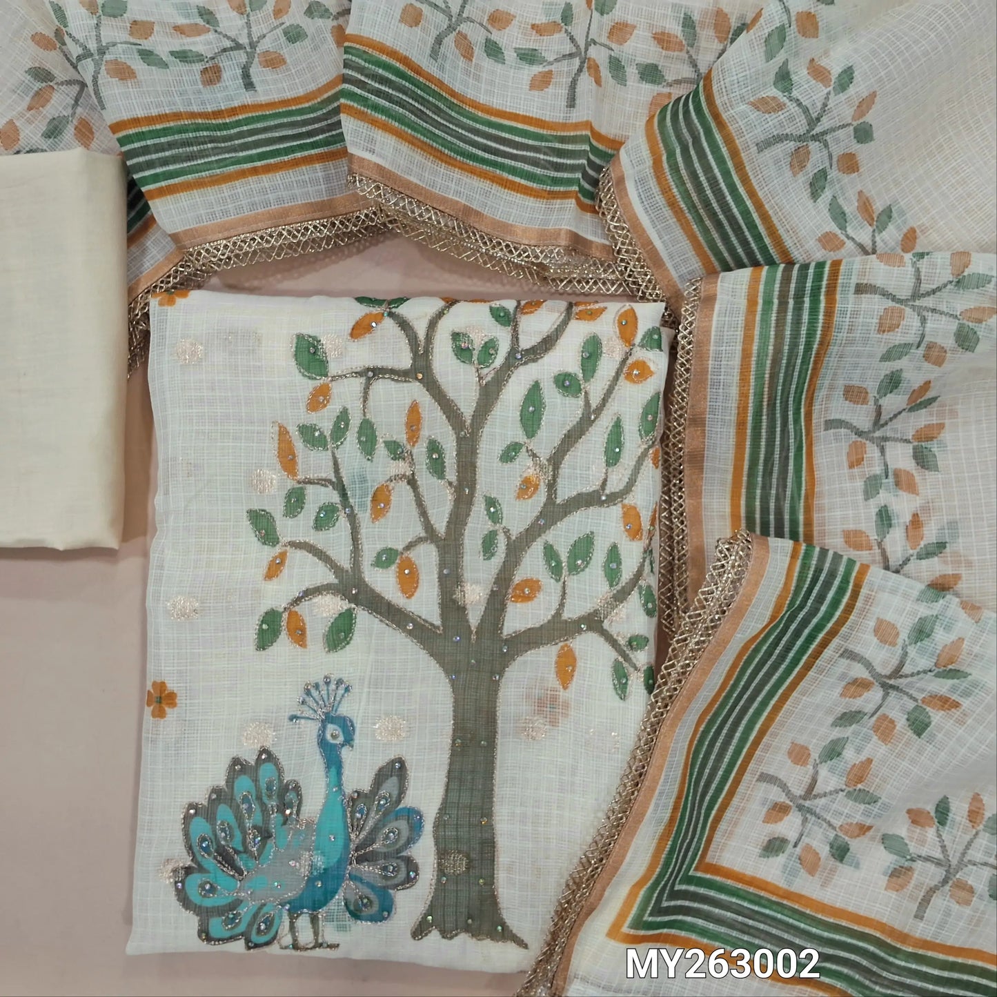 Off white base floral printed benarasi chanderi kota unstitched salwar material,v neck on yoke,digital print,zari & sequins work on daman, zari woven all over( lining needed)cotton bottom,digital printed benarasi kota dupatta with lace tapping. MY263002