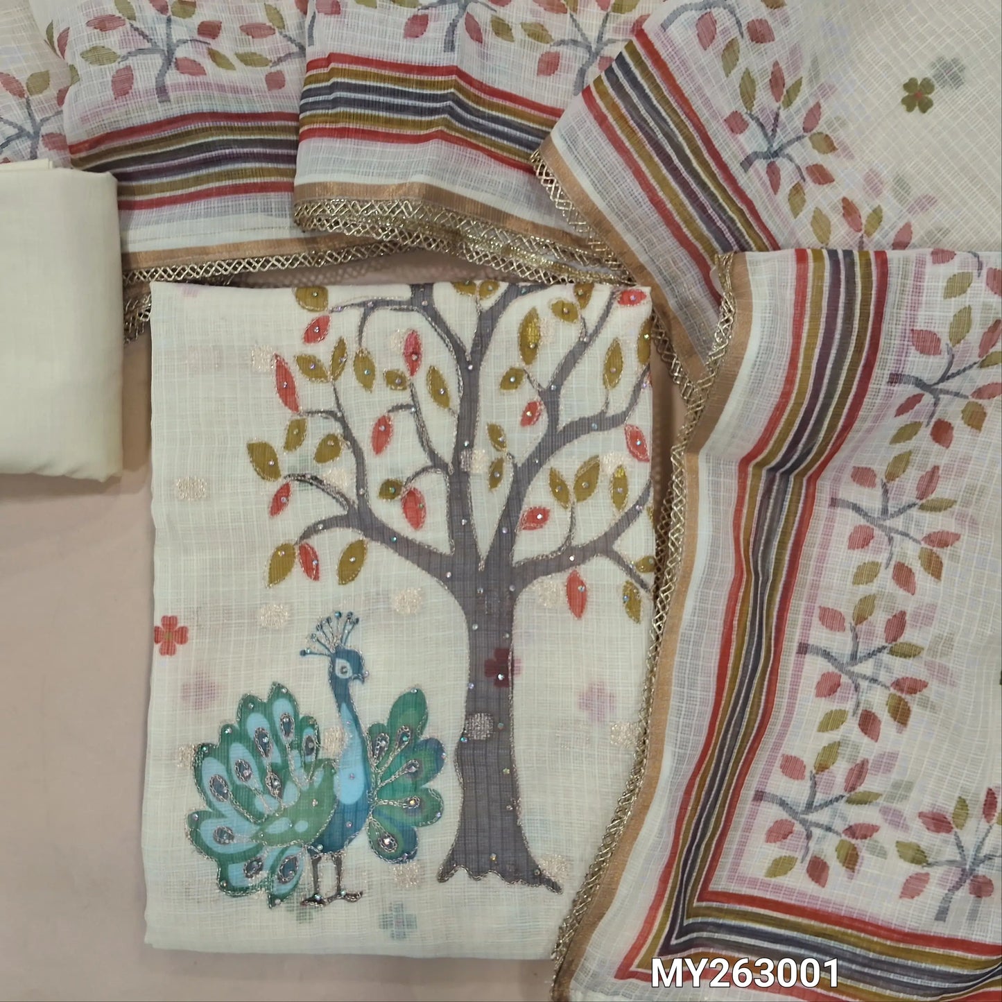 Off white base floral printed benarasi chanderi kota unstitched salwar material,v neck on yoke,digital print,zari & sequins work on daman, zari woven all over( lining needed)cotton bottom,digital printed benarasi kota dupatta with lace tapping. MY263001