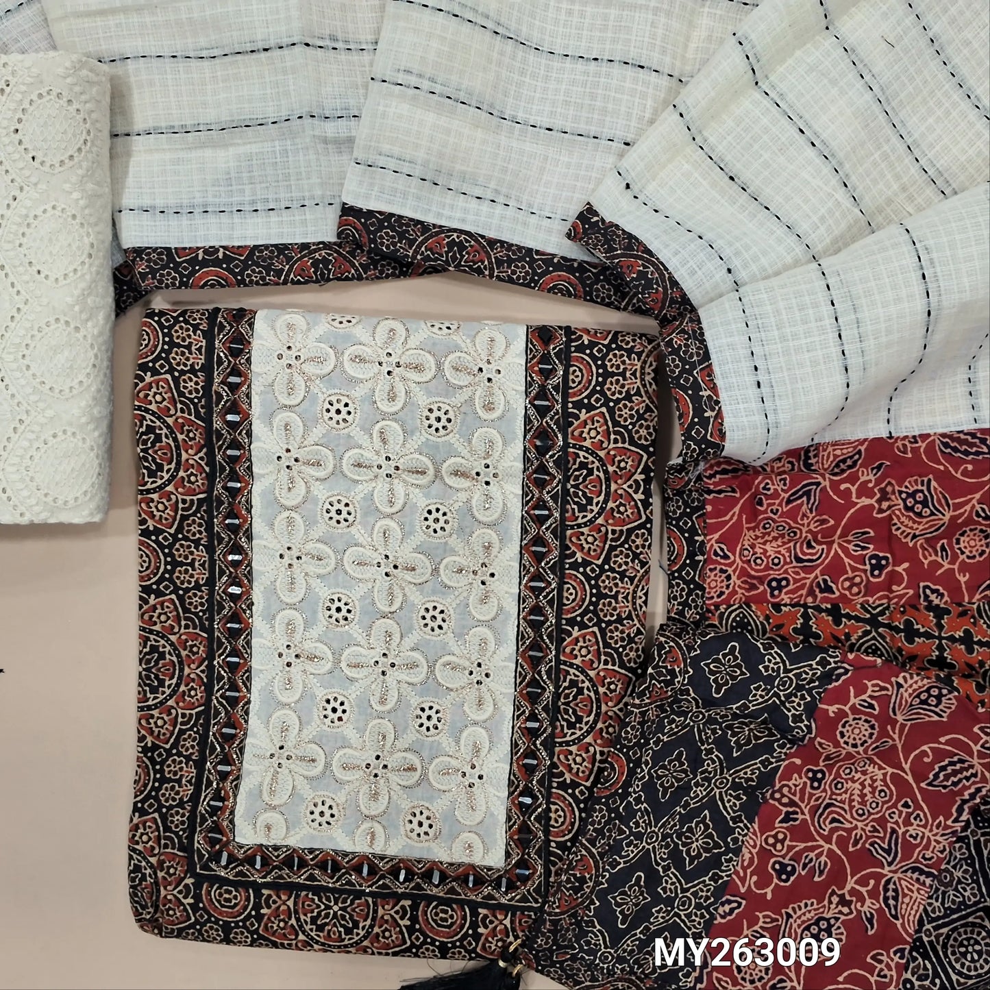 Black ajrak hand block printed premium pure cotton unstitched salwar material(lining optional)embroidery & real mirror work on yoke, schiffli embroidery cotton bottom, kantha stitch detailing & applique work on kota dupatta with pallu. MY263009
