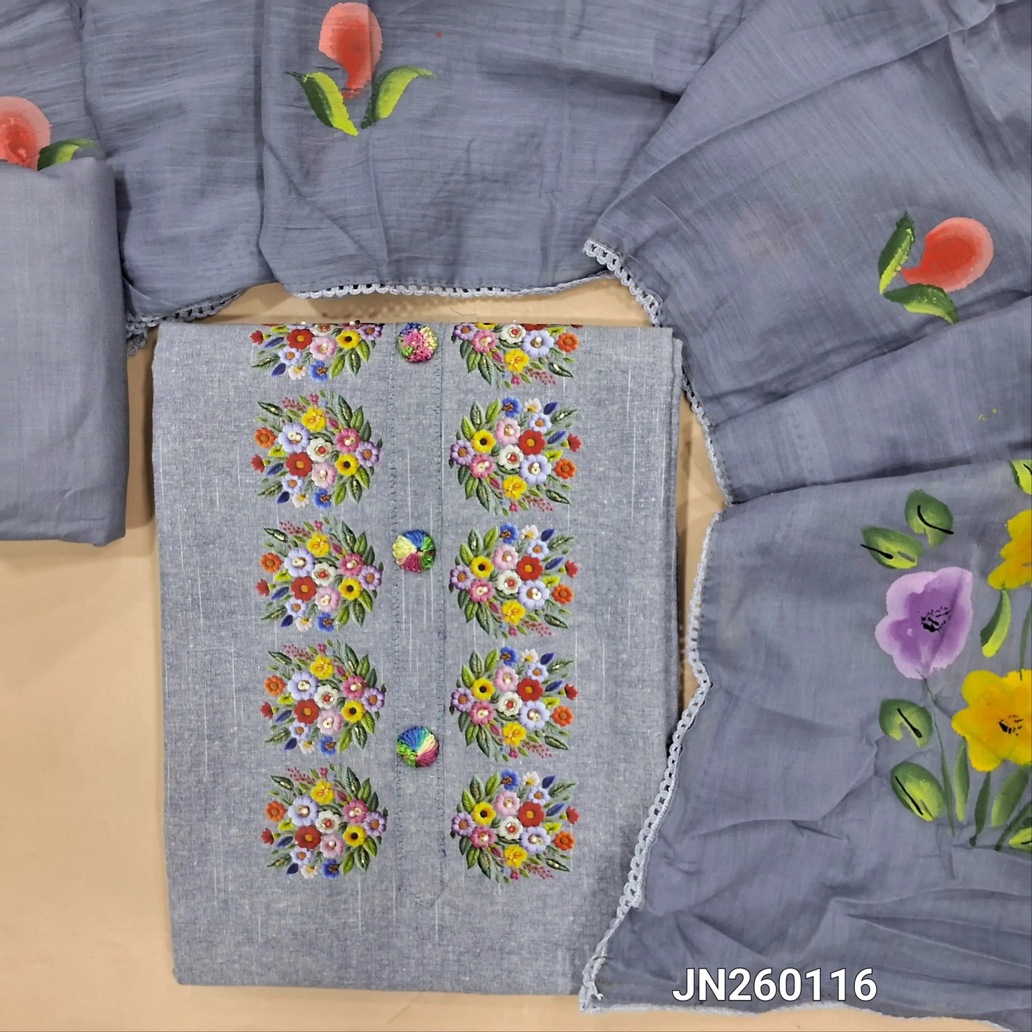Denim blue spun cotton unstitched salwar material,floral printed, bead work and thread embroidery buttons on yoke, rich daman,(lining optional)cotton bottom,brush paint work on mul cotton dupatta. JN260116
