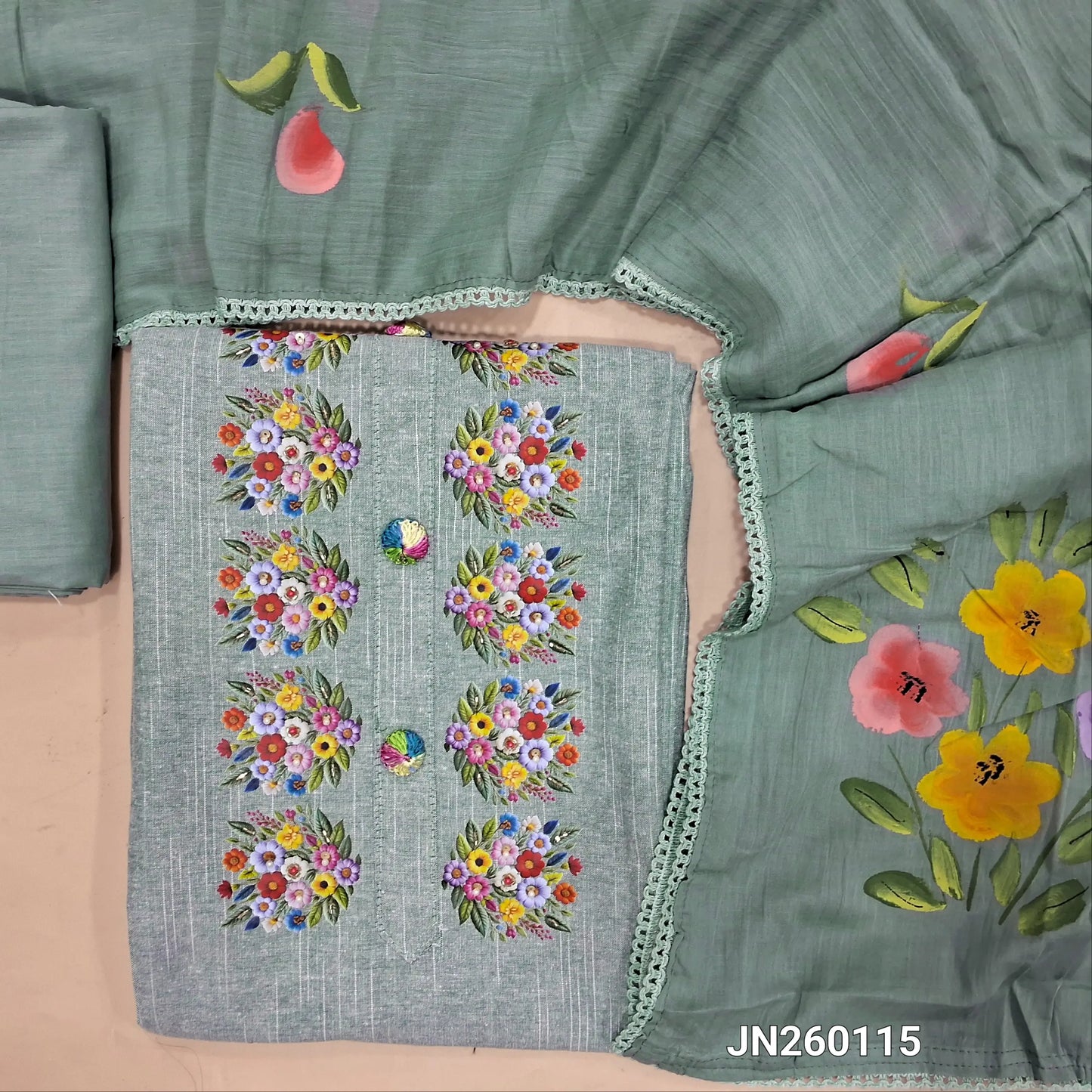 Greyish blue spun cotton unstitched salwar material,floral printed, bead work and thread embroidery buttons on yoke, rich daman,(lining optional)cotton bottom,brush paint work on mul cotton dupatta. JN260115