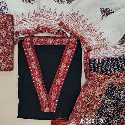 Black premium dobby cotton unstitched salwar material,collar neck with ajrak &real mirror work on yoke, self woven design all over(lining needed) reddish maroon block printed cotton bottom, block printed kota dupatta with applique work on pallu. JN260110