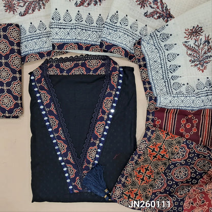 Black premium dobby cotton unstitched salwar material,collar neck with ajrak &real mirror work on yoke, self woven design all over(lining needed) dark blue block printed cotton bottom, block printed kota dupatta with applique work on pallu. JN260111