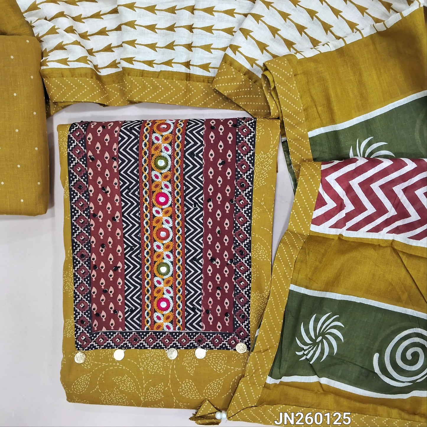 Mehandhi yellow printed pure cotton unstitched salwar material, ajrak yoke patch with hand embroidery work(lining optional)printed cotton bottom,printed soft mul cotton dupatta. JN260125