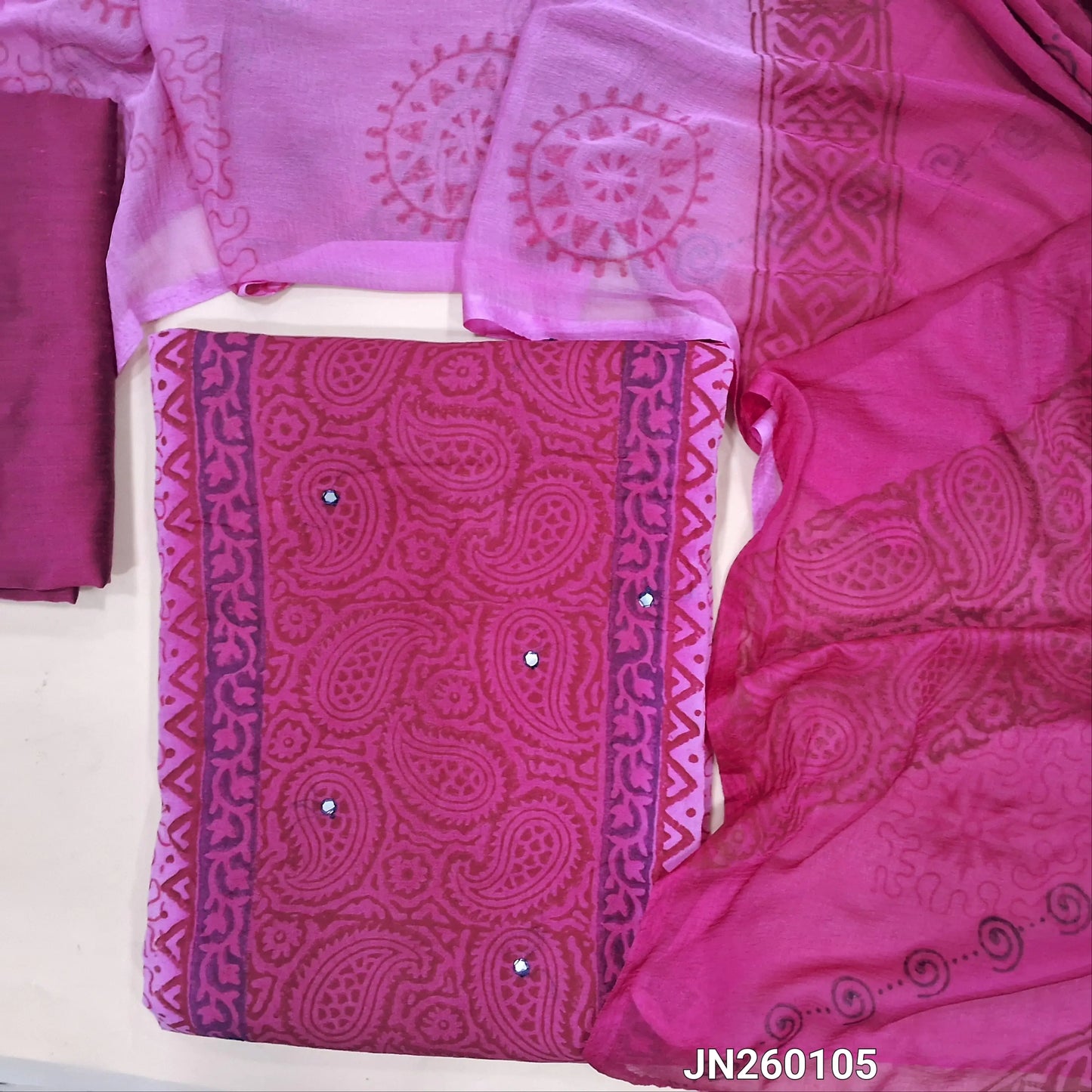 Dark pink & light Pink block printed semi georgette unstitched salwar material,(lining needed)panel design, faux mirror work on front,dark pink silk cotton bottom, block printed dual shaded fancy chiffon dupatta.(TAPING NEEDED) JN260105