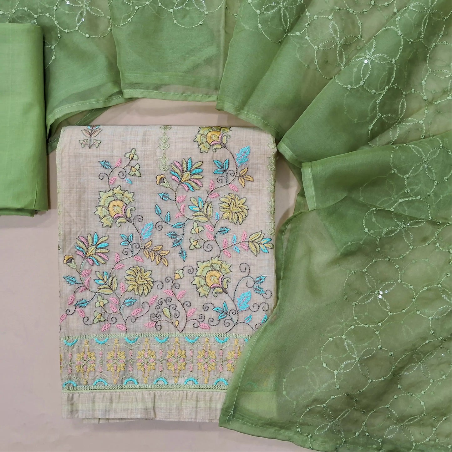Beige embroidered silk cotton unstitched salwar material, rich embroidery on front (Lining Needed) sage green cotton bottom, fancy organza embroidered dupatta. MY263125