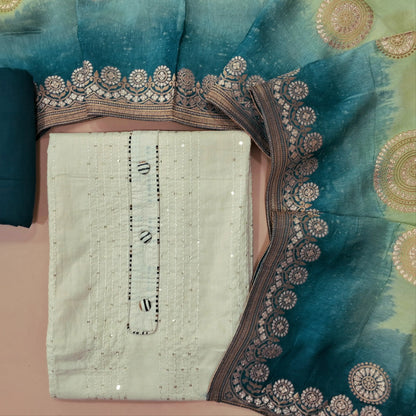 Off white soft cotton unstitched salwar material, sequins work on front,buttons on yoke(lining optional)teal blue bottom,dual shaded benarasi zari woven dupatta. MY263111