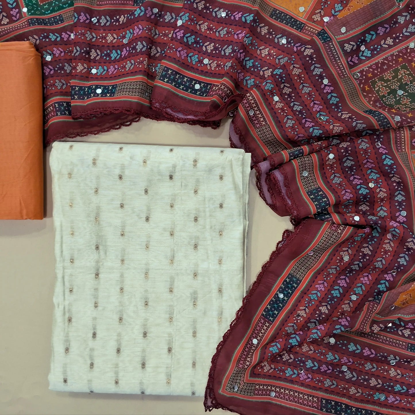 Ivory silk cotton benarasi zari woven unstitched salwar material (Lining Needed) peach silk cotton bottom, multicolor fancy chiffon dupatta with real mirror work. MY263123