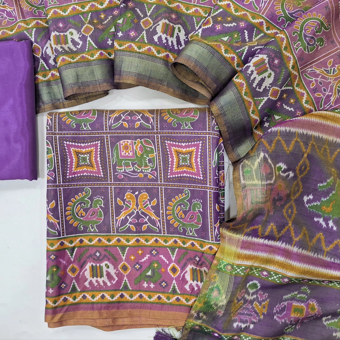 Dark mauve shade ikat printed fancy silk unstitched salwar material(silky fabric, lining needed)silky bottom,printed full length fancy silk dupatta(REQUIRES TAPINGS). MY263104