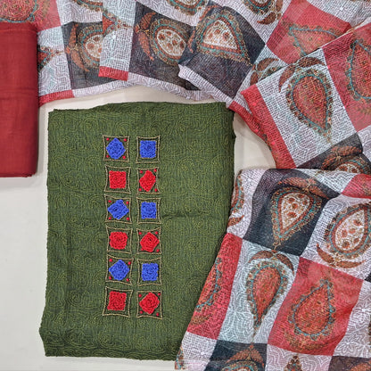 Dark olive green kota unstitched salwar material,french knot work and bead work on yoke,rich embroidery work all over,(Lining Needed)reddish maroon cotton bottom, self embroidery and colourful abstract printed kota dupatta. MY263101