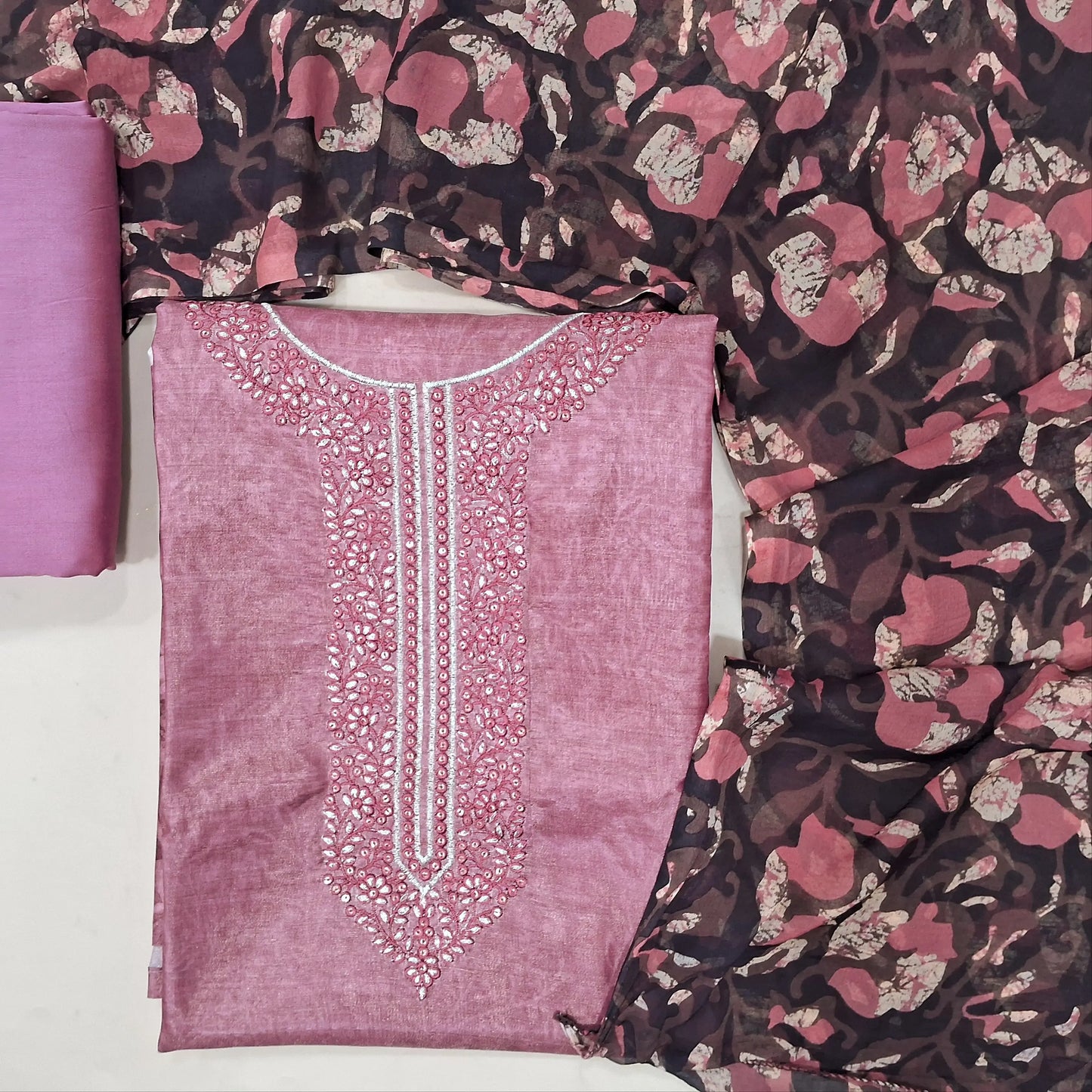 Pink with golden tint tissue silk cotton printed unstitched salwar material, thread weaving on yoke (Lining Needed), matching silk ctton bottom, printed fancy chiffon dupatta. MY263119