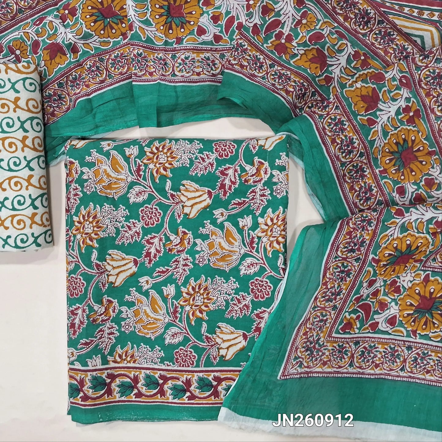 Teal green floral printed pure cotton unstitched salwar material,(lining optional)printed cotton bottom, block printed pure mul cotton dupatta. (TAPINGS NEEDED, INCONSISTENT PRINTS ARE NOT DEFECTS)JN260912