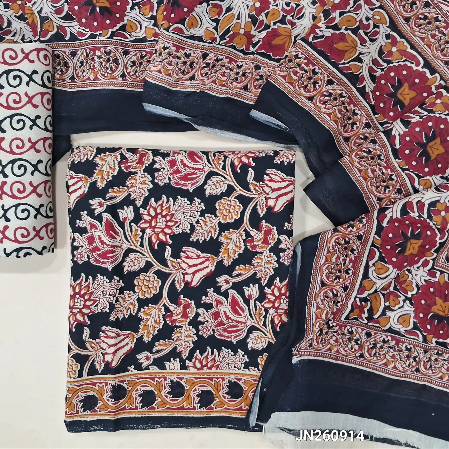 Black floral printed pure cotton unstitched salwar material,(lining optional)printed cotton bottom, block printed pure mul cotton dupatta. (TAPINGS NEEDED, INCONSISTENT PRINTS ARE NOT DEFECTS)JN260914
